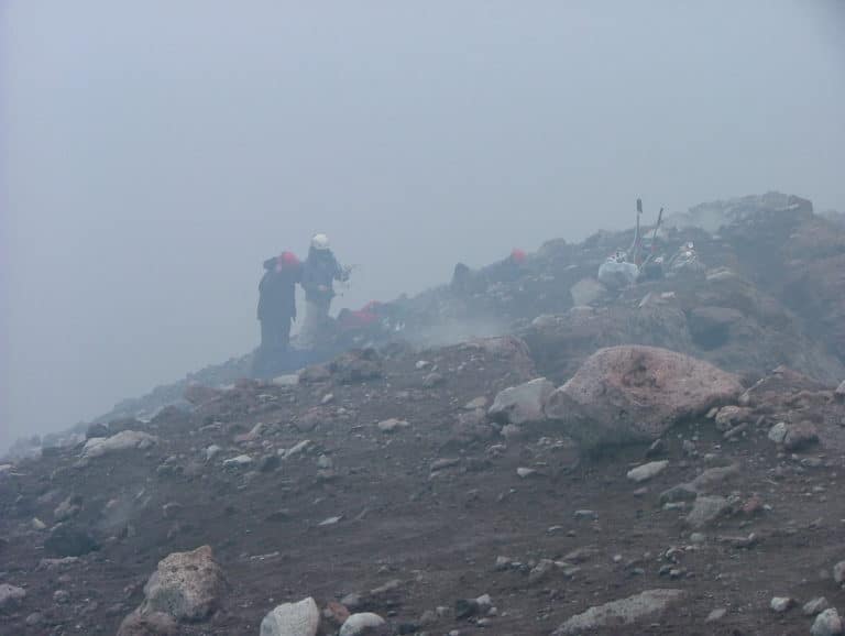 Sampling volcanic gases on the edge of a volcanic crater 2: Mt Etna, Sicily. Photo credit: David Pyle, University of Oxford.