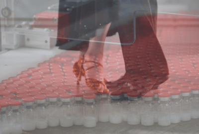 The feet of two ballroom dancers, merged with vials of antibiotics.
