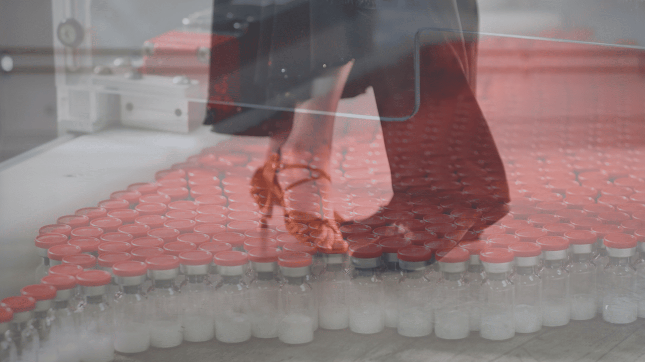 The feet of two ballroom dancers, merged with vials of antibiotics.