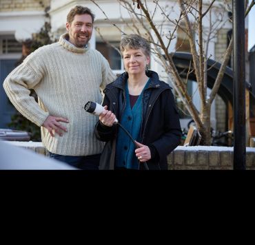 Dr Phil Grünewald (left) and Dr Tina Fawcett (right) with a charger for an electric vehicle. Image credit: Ian Wallman.