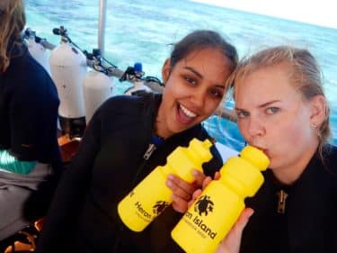 Photo of Lauren Rudd and friend on a boat at sea