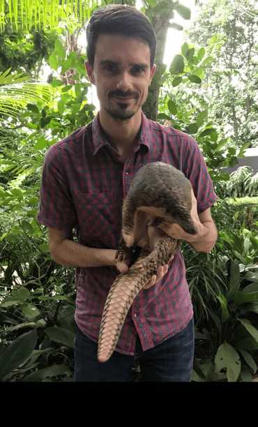 Dr Dan Challender with a Sunda pangolin Manis javanica. Image credit: Dr Dan Challender.