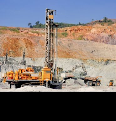 A large drilling machine in the middle of a mining site. Image credit: Shutterstock.