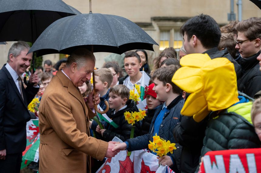 Image of the King (then His Royal Highness The Prince of Wales) visiting Jesus College in 2020 to celebrate the College’s Welsh access programmes and mark the restoration of the Jesus Chair of Celtic. Pictured meeting children from Welsh primary schools.