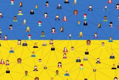A network of cartoon people against a backdrop of the Ukrainian flag. Website image for the podcast episode 'How do you use social media to deliver humanitarian aid?'