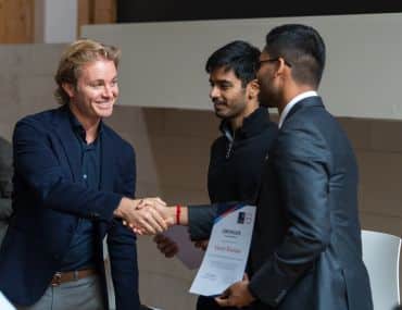 Image of Nico Rosberg shaking hands with Varun Shankar