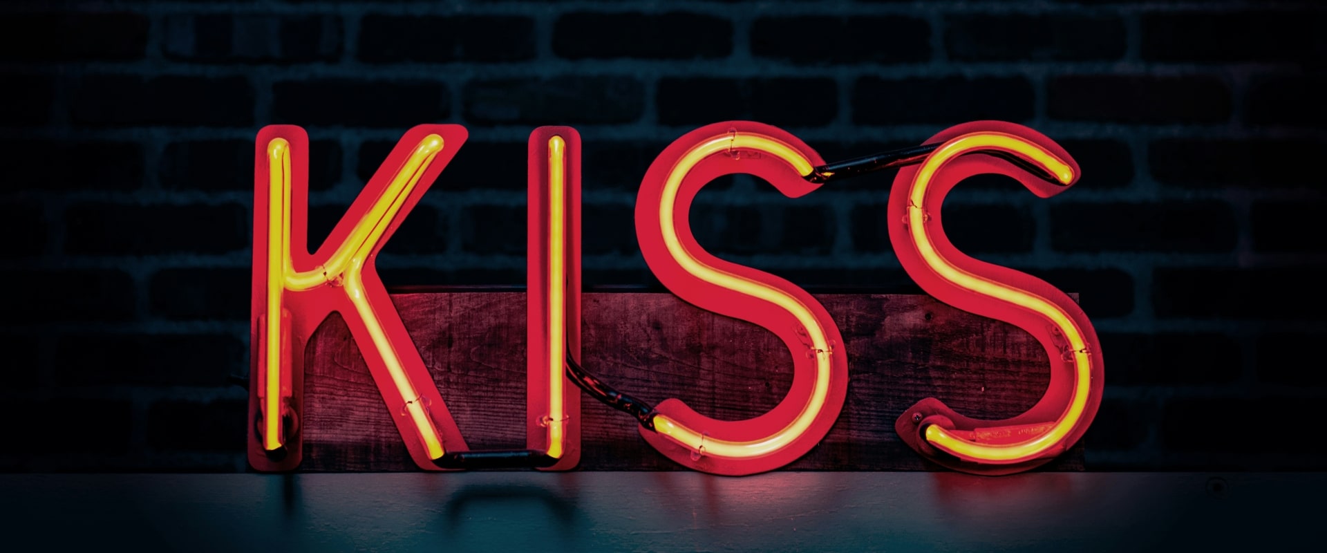 Neon letters spelling kiss