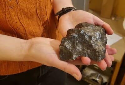 Hannah holding a meteorite sample
