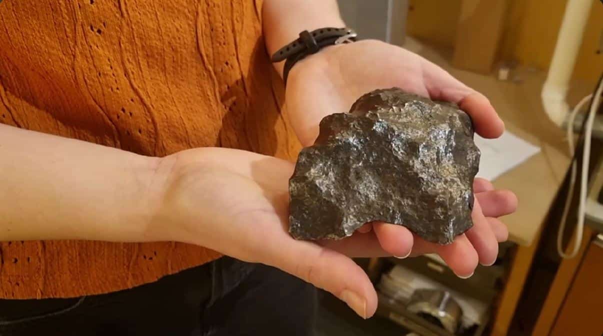 Hannah holding a meteorite sample