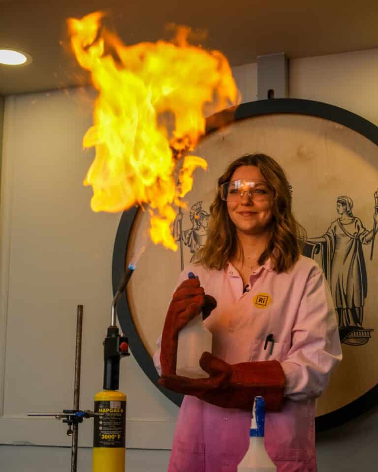 Arianwen Herbert demonstrates an experiment at the Royal Institution in London.